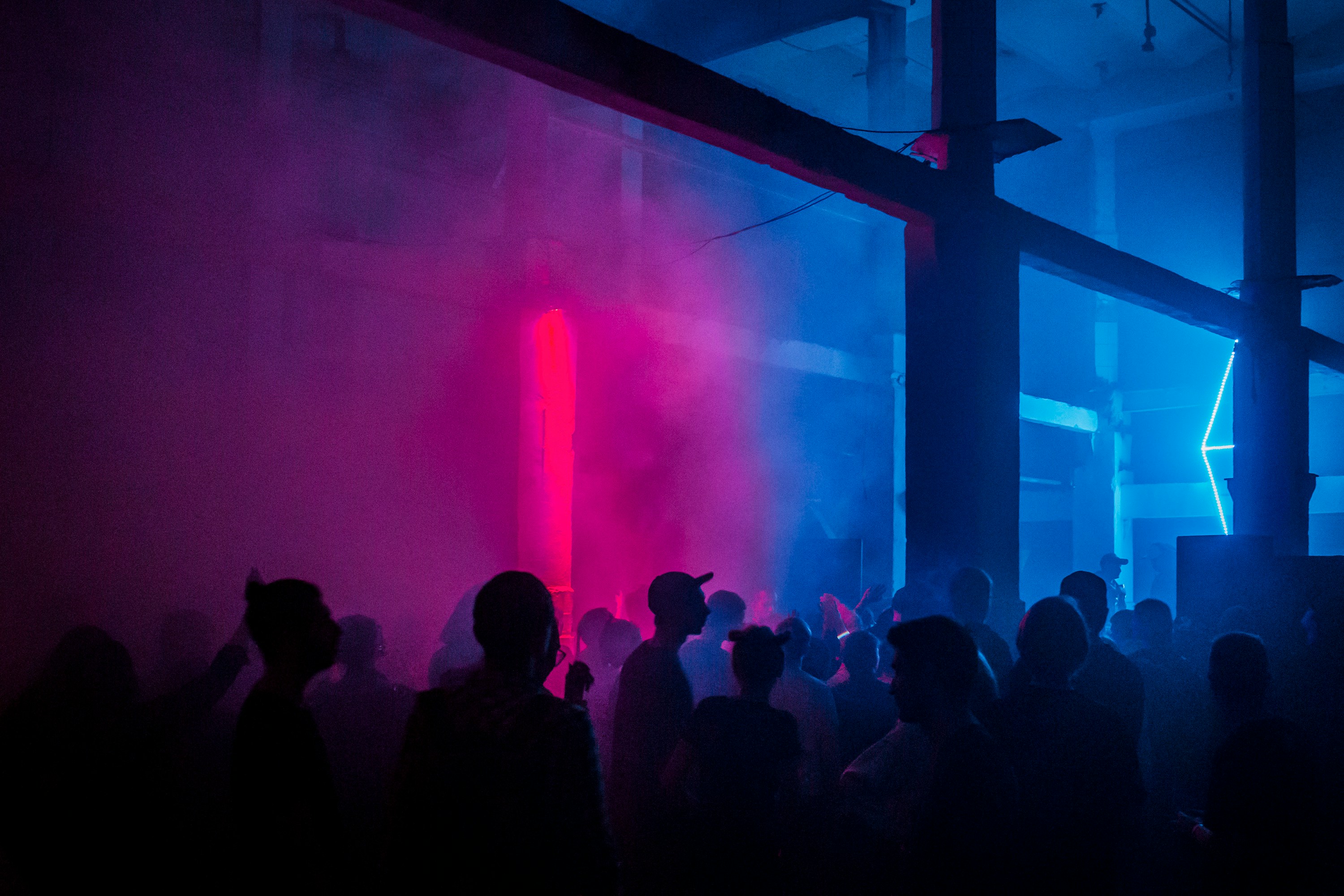 a group of people standing around in a room