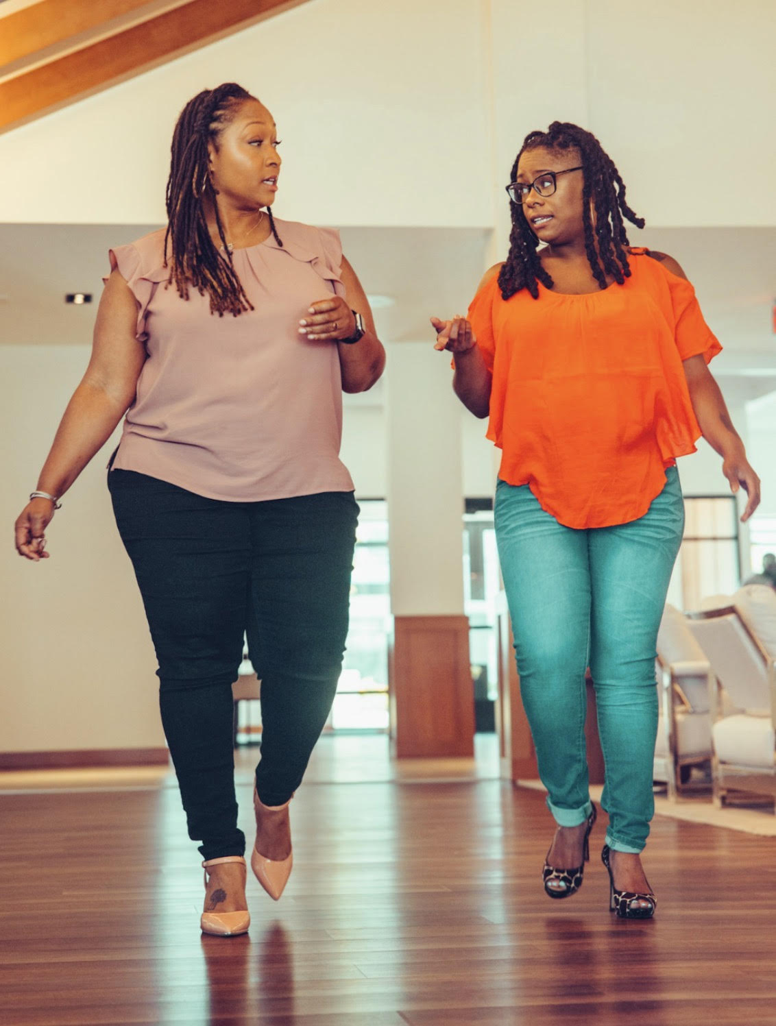 person sitting in a chair in front of a man