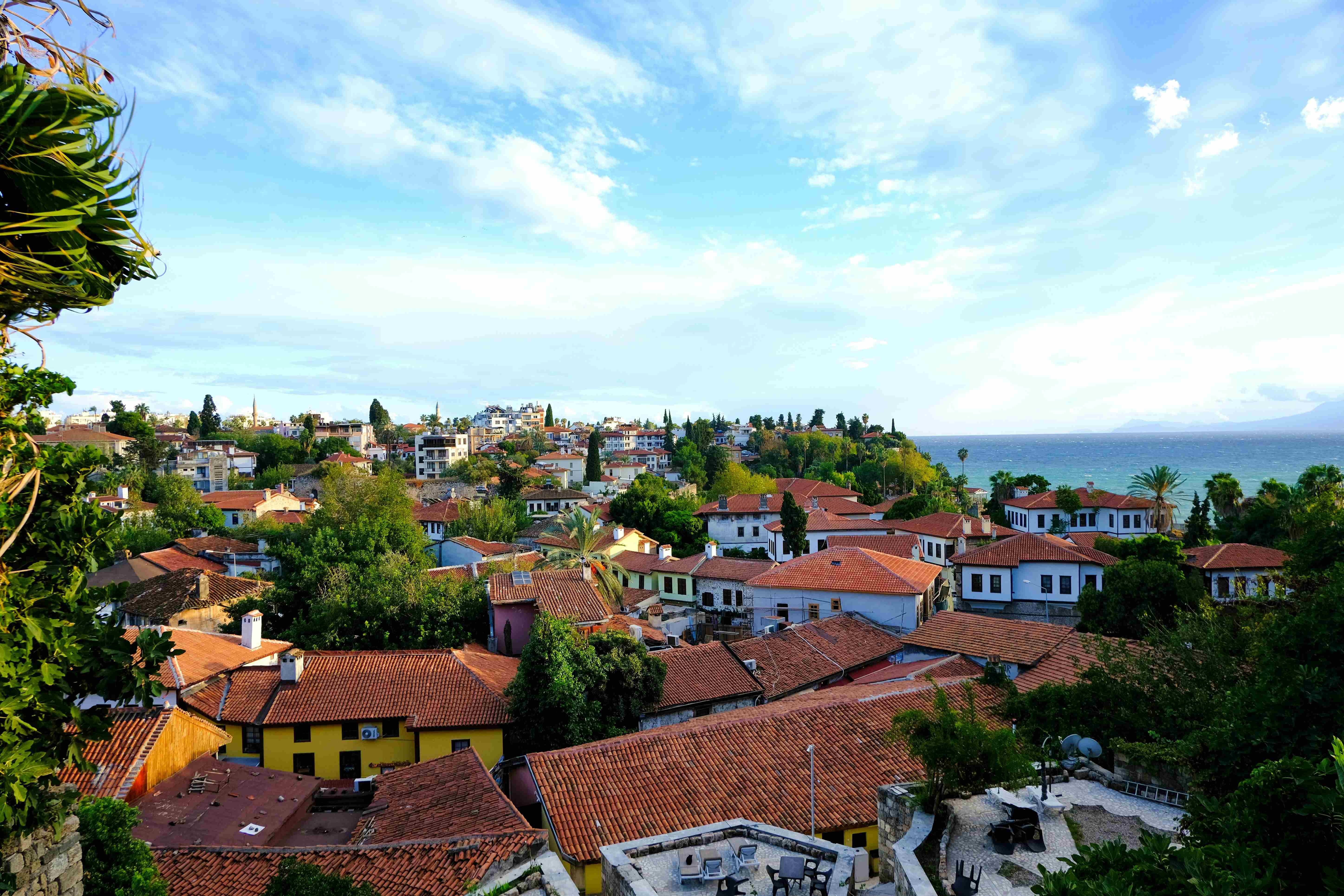 Antalya old town rooftops and coastline, viewed from an elevated perspective.