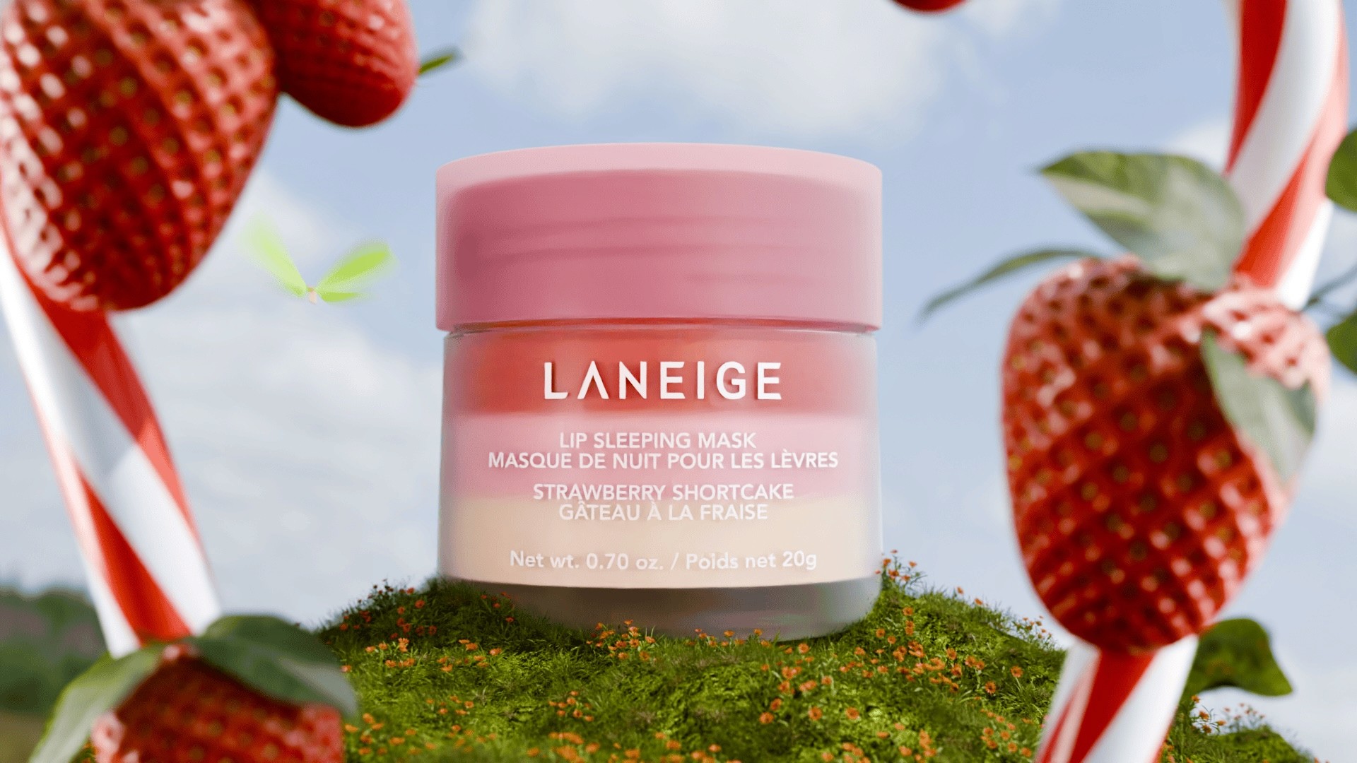 3D render of Laneige strawberry shortcake lip sleeping mask on a grassy hill