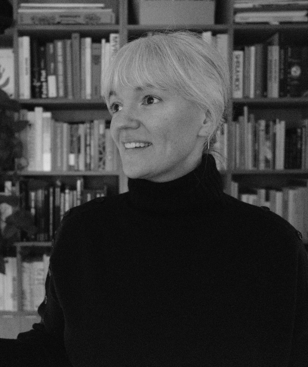 a blurry photo of a person standing in front of a wall