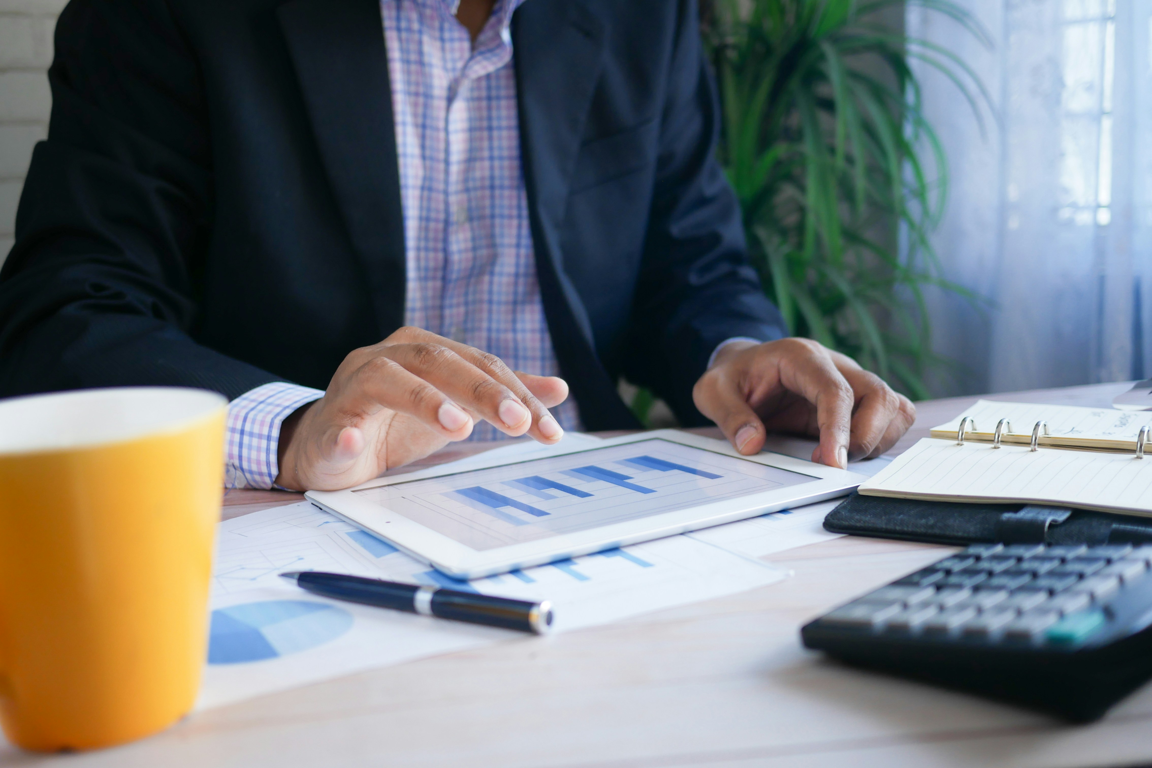 An insurance person analyzing data from a chart