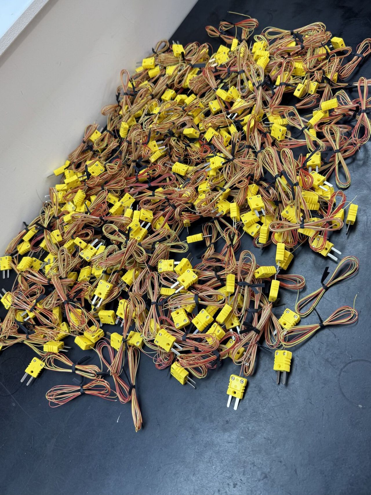 A small airplane flying through a blue sky