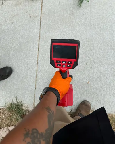 plumber inspecting a residential property in arlington, TX
