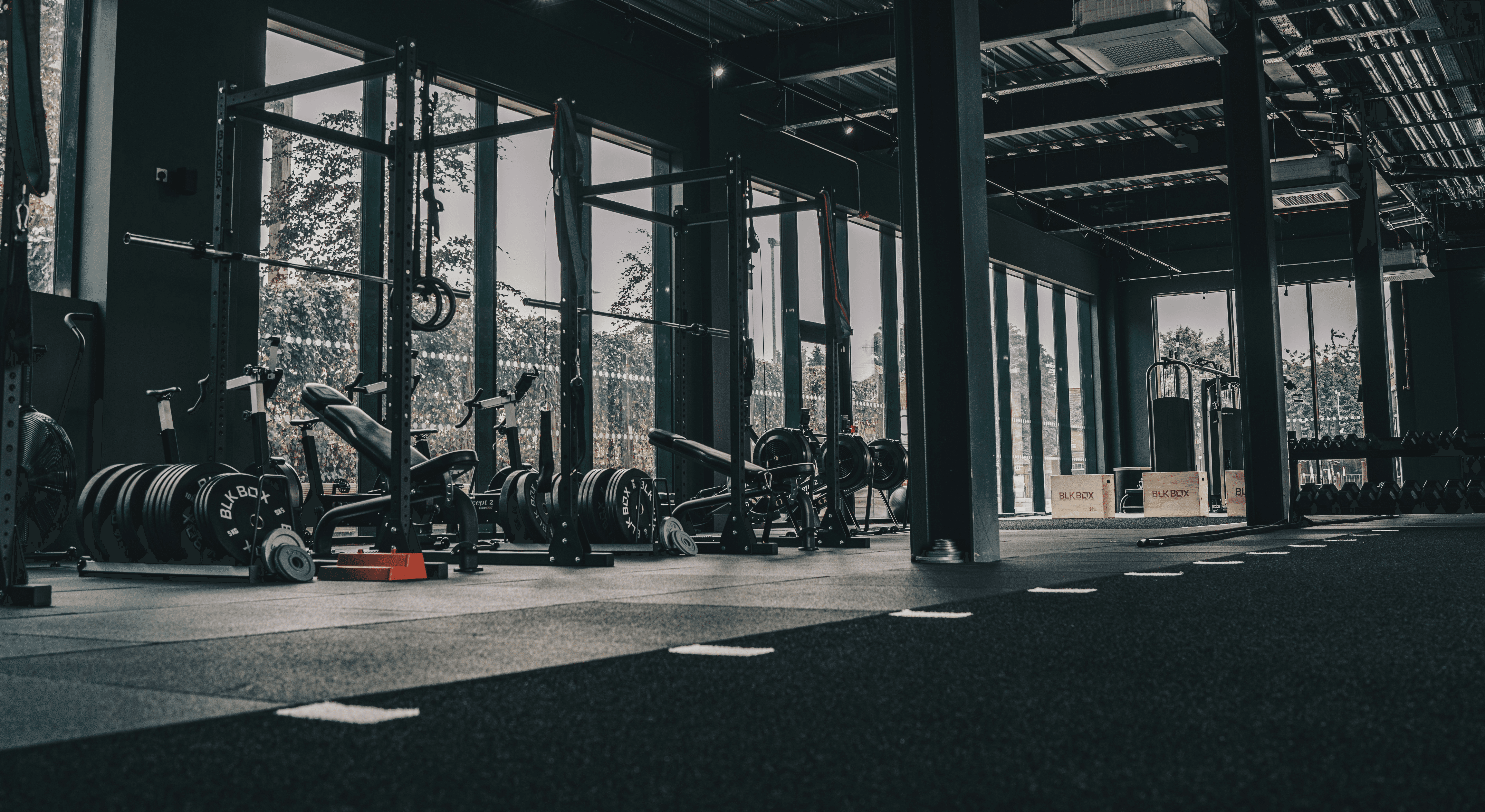 A large gym with a lot of machines