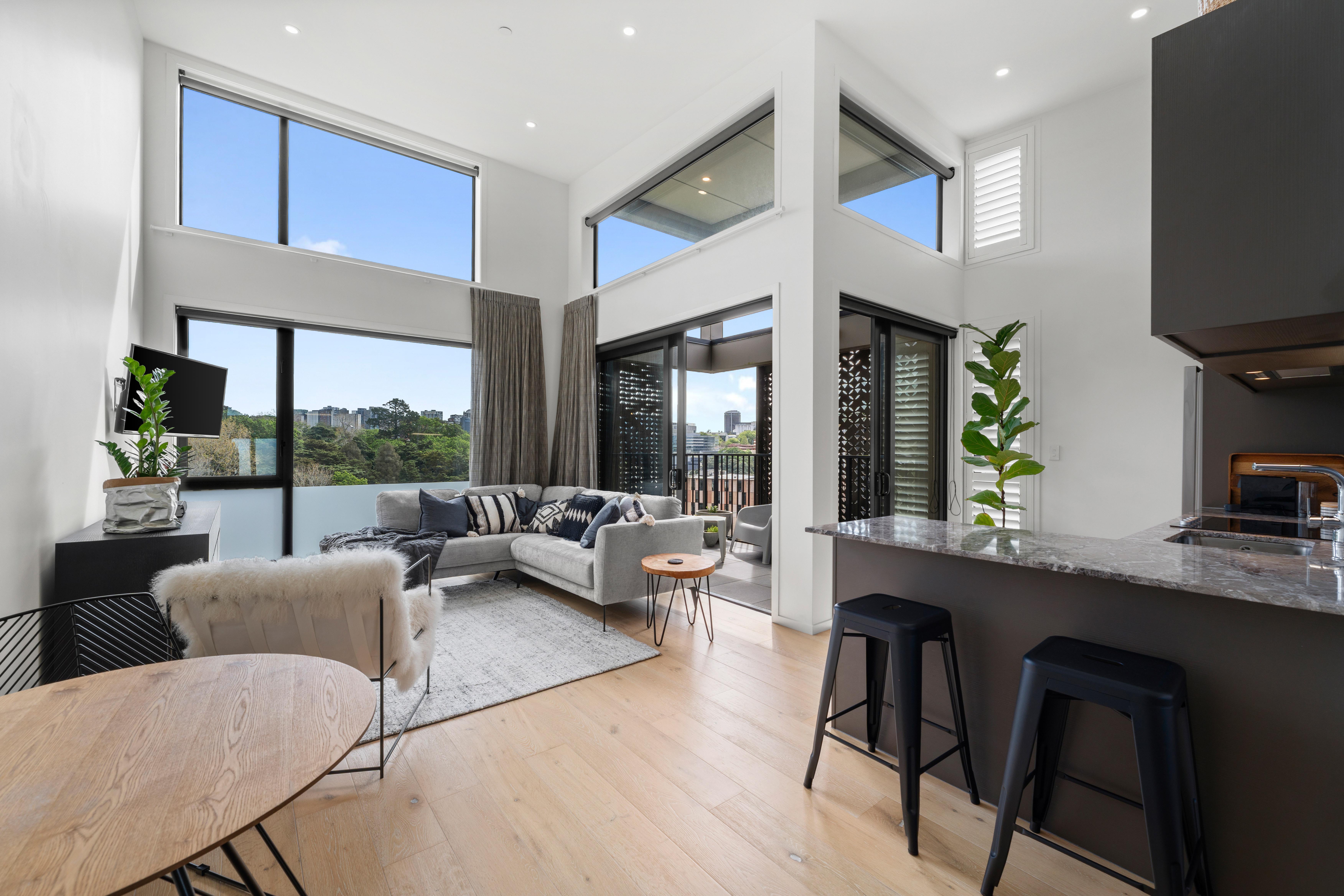 man wearing gray polo shirt beside dry-erase board