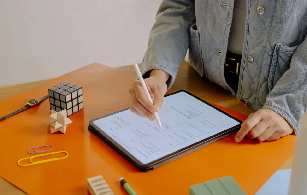High school students exploring STEM, RISE Research, or summer programs use tablets for digital design, data entry, or problem-solving in creative workspaces.