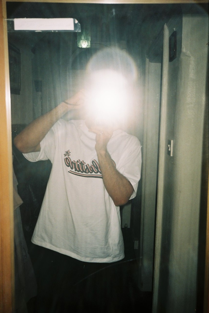 a blurry photo of a person standing in front of a wall