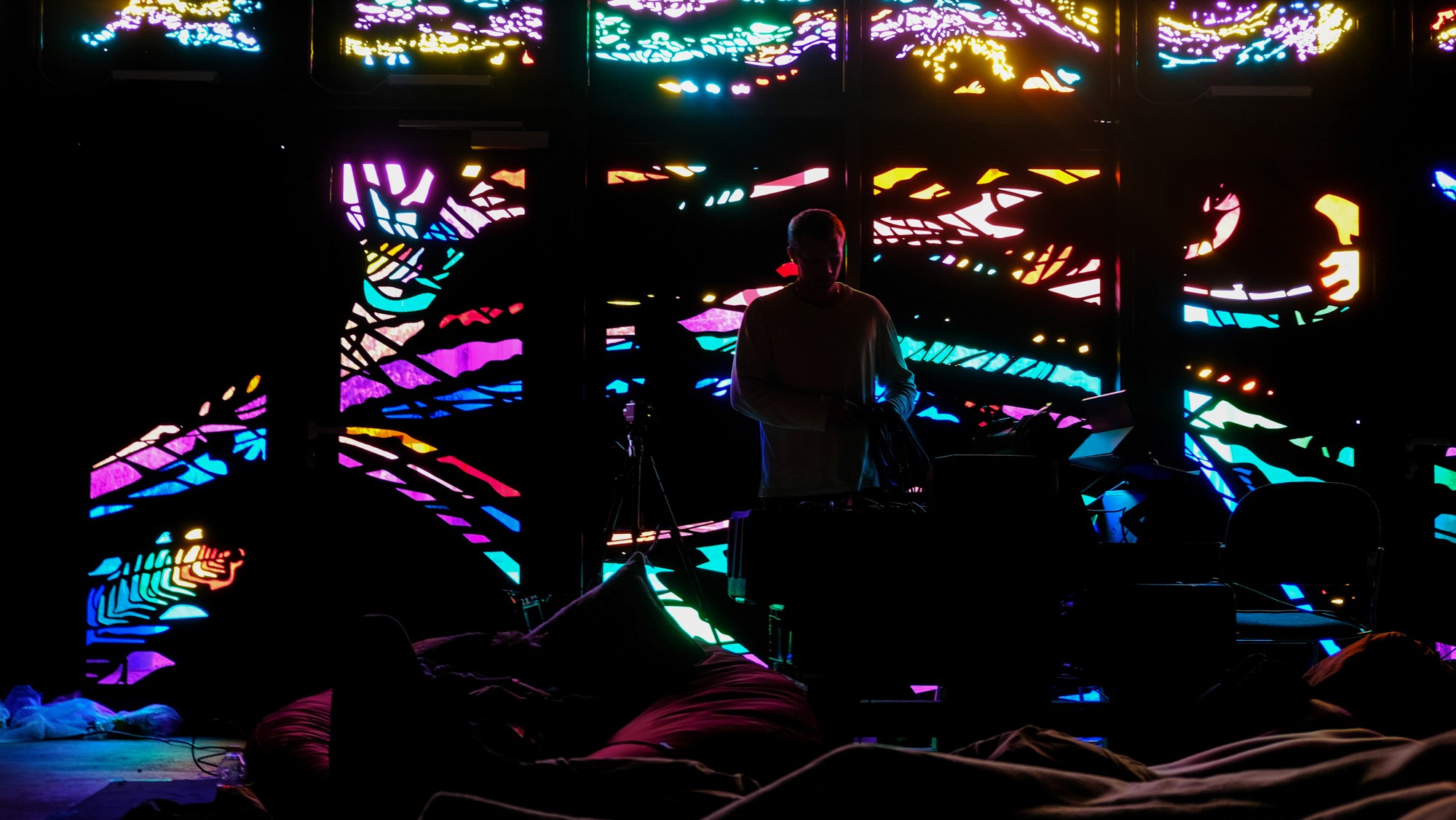 A small bird perched on a blooming cherry blossom branch.