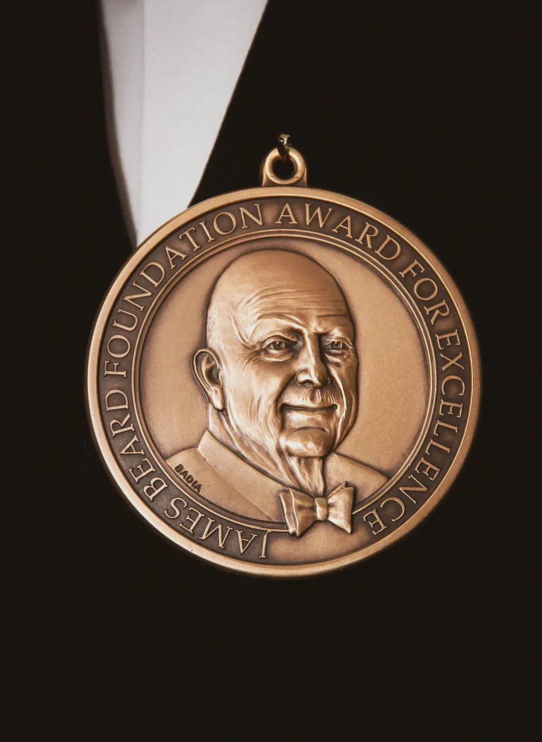 Bronze James Beard Foundation Award for Excellence medal with a portrait of James Beard.
