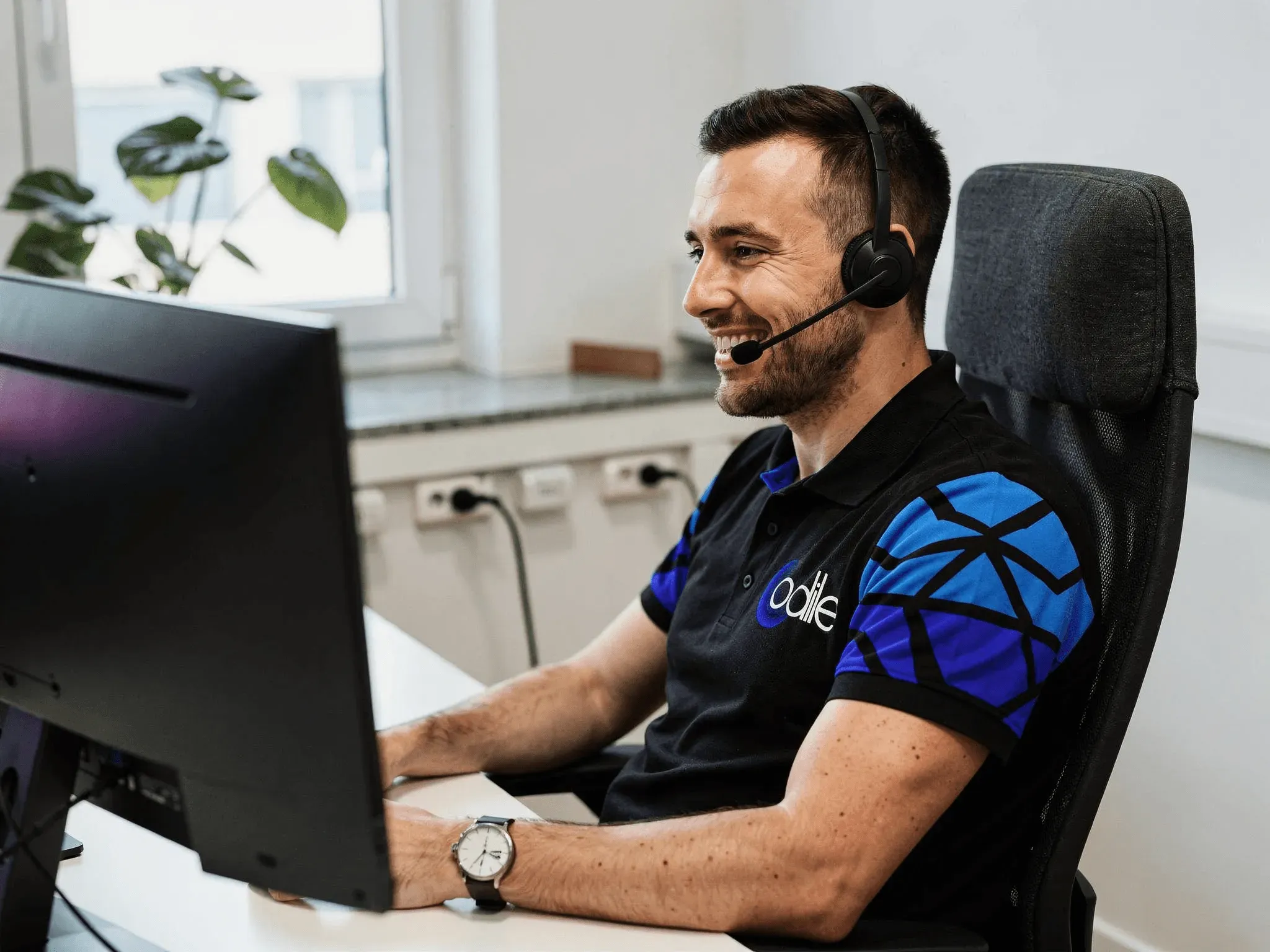 people sitting near table with laptop computer