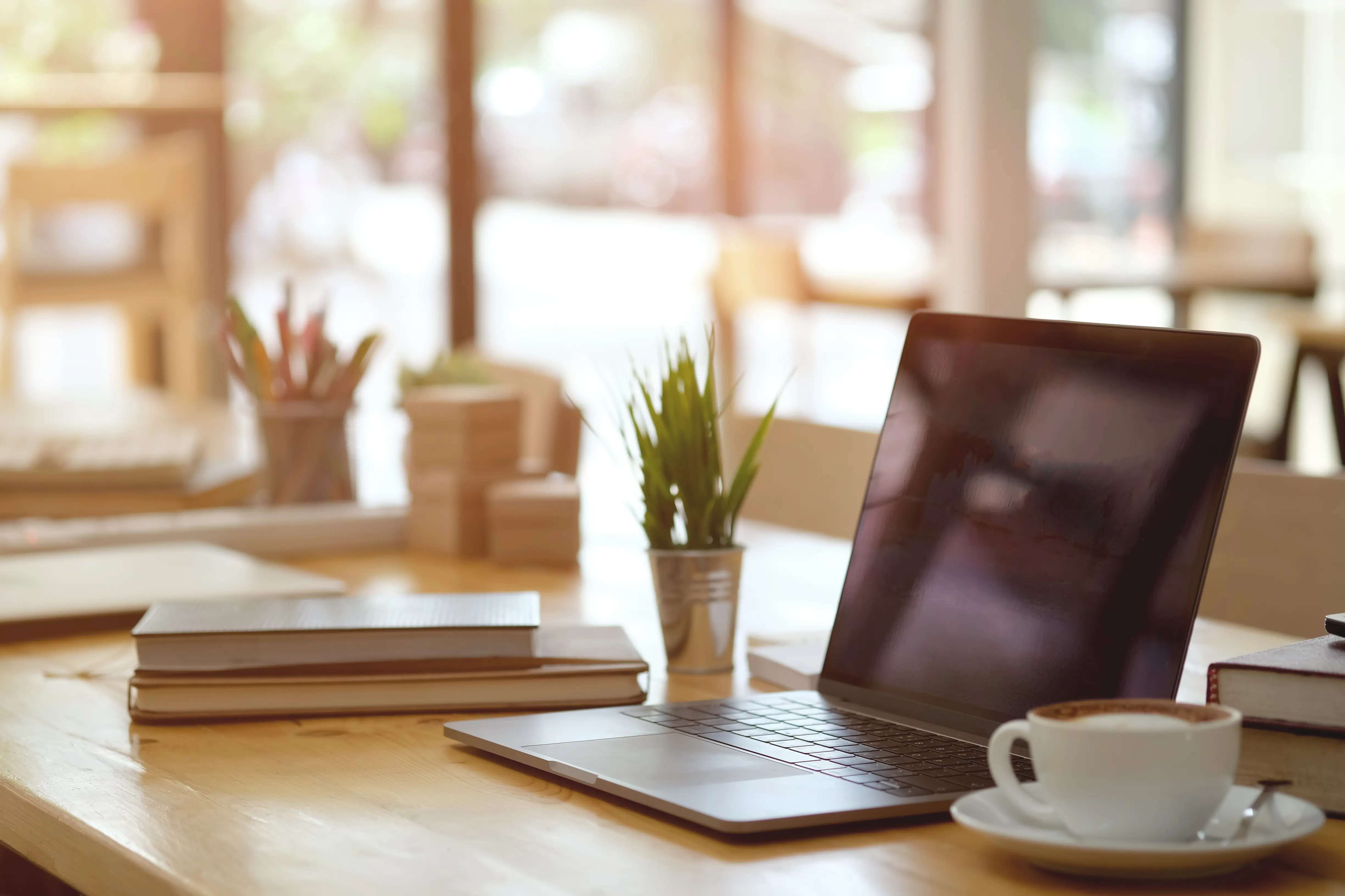 Insurance agent workspace with documents and laptop