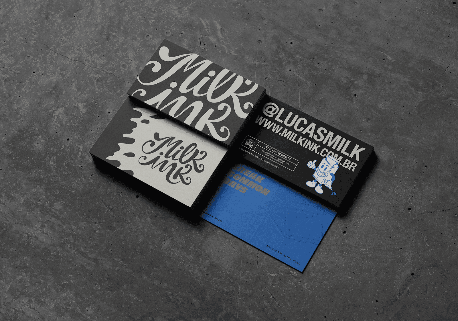 Imagem mostra cartões de visita da Milk Ink.