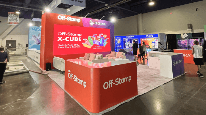Geekbar CHAMPS Las Vegas 2025 July 20x60 booth with product display counter, large branded wall, and buyer-facing retail presentation