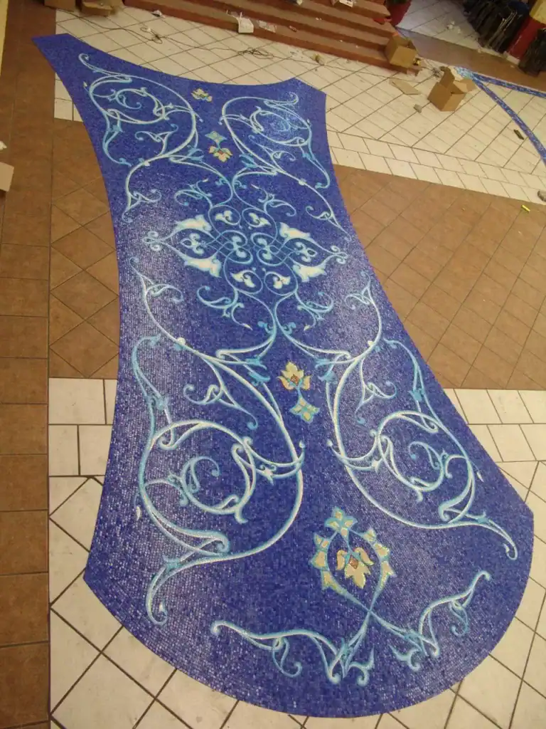 Mosaic glass pool with intricate blue and yellow designs on Naples Bay.