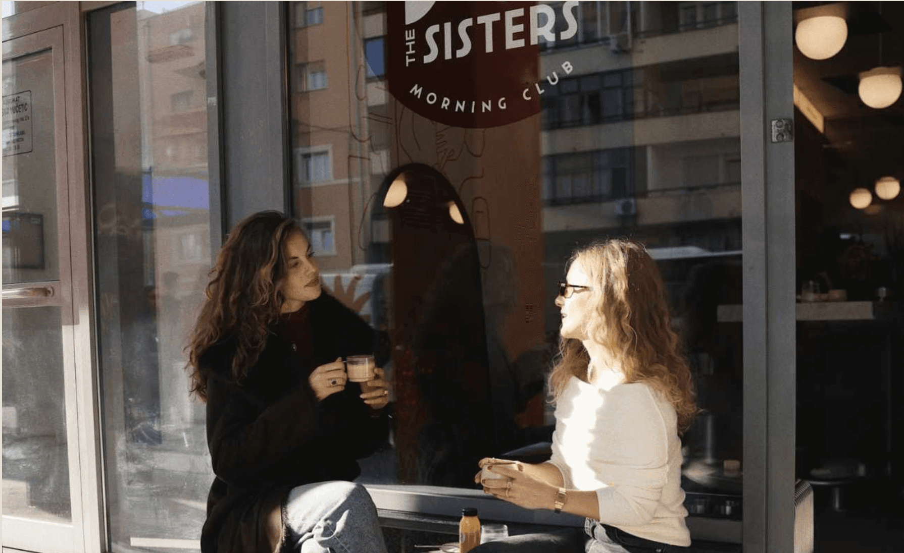 Two women enjoying coffee outside Jo & The Sisters Morning Club in Split