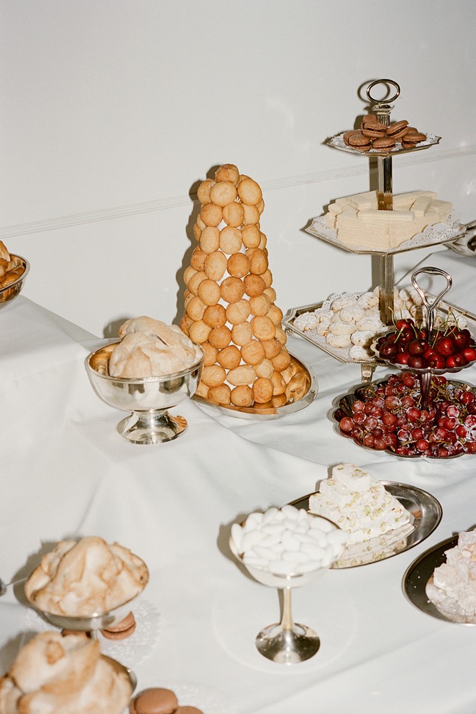Wedding dessert table with tiered pastries and minimalist presentation