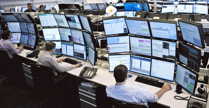 People at their trading desks