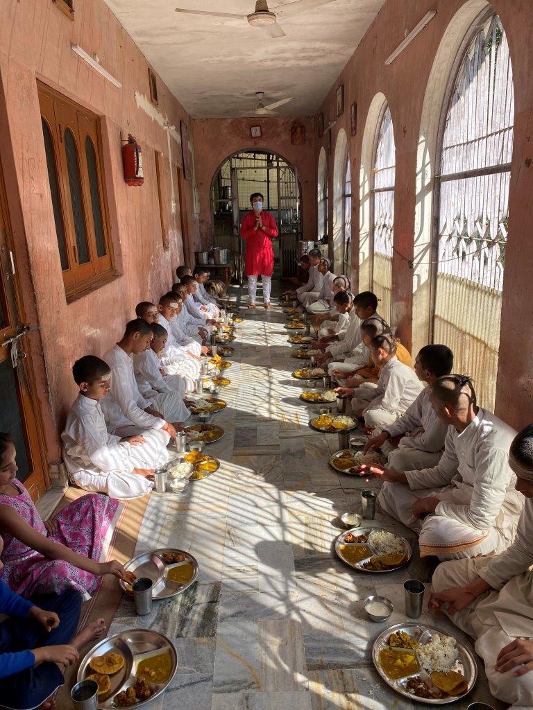 serving meal to yogis