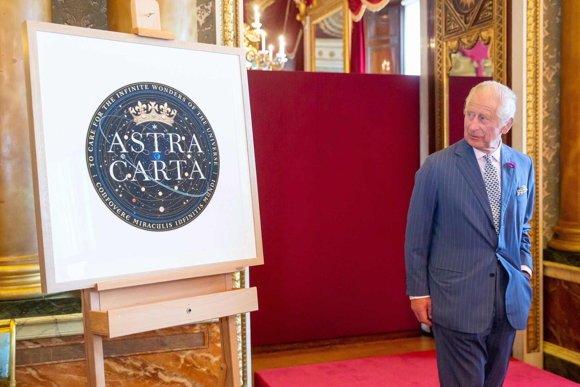 Man standing beside the Astra Carta initiative sign.