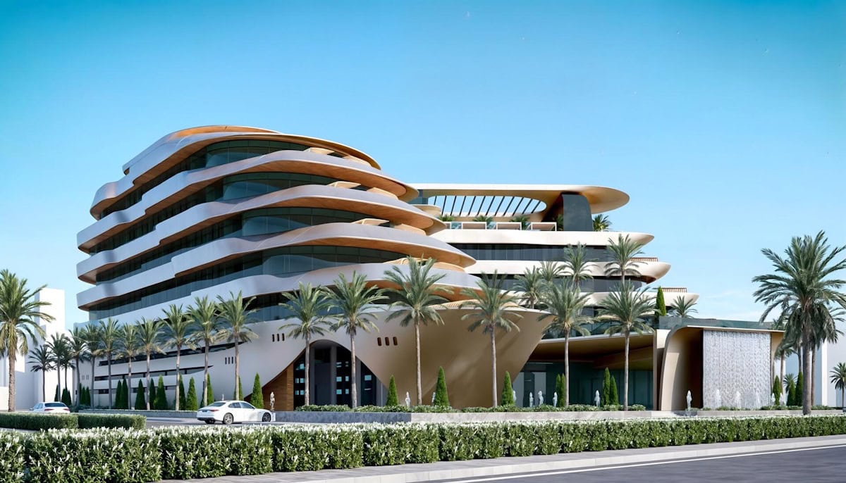 The Yacht Royal is a modern structure characterized by its elegant curved sides and roof, reflecting innovative design.