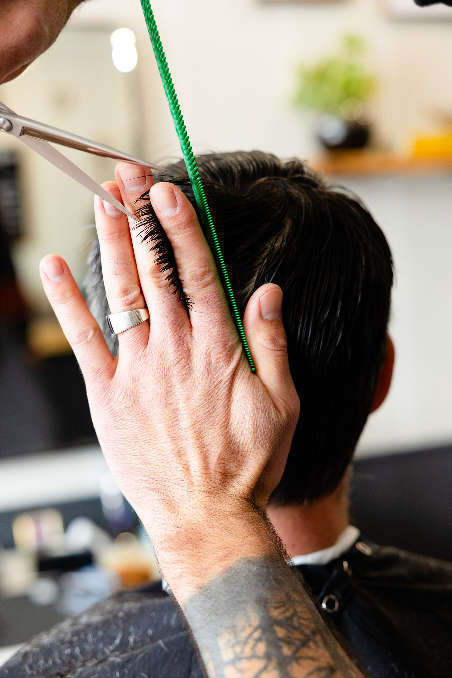 Calderone's Barbershop barber trimming client's hair close up barbershop photography Geneva IL
