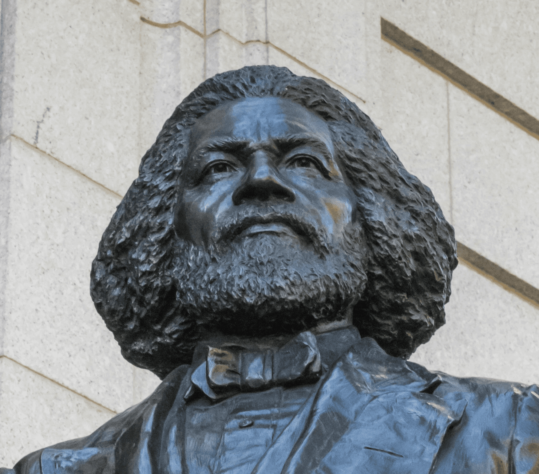 a statue of a man with a book in his hand