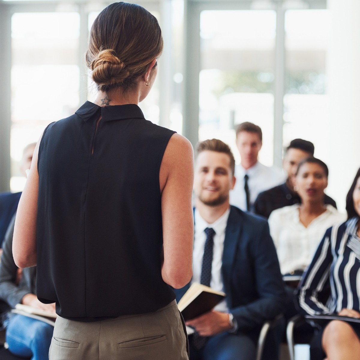 Lady speaking at a conference