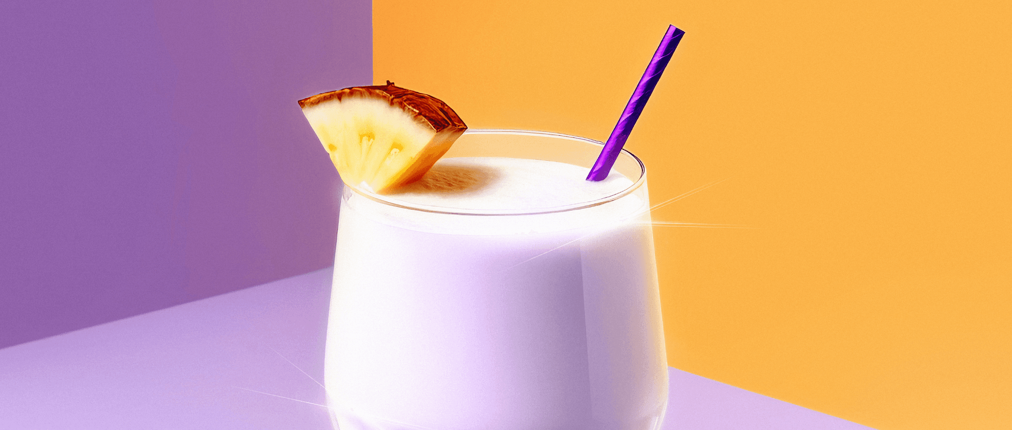 Close-up of a glass filled with a frosty purple blended drink