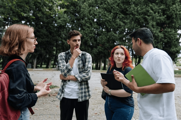 High school student conducting climate policy research with a PhD mentor in a university setting