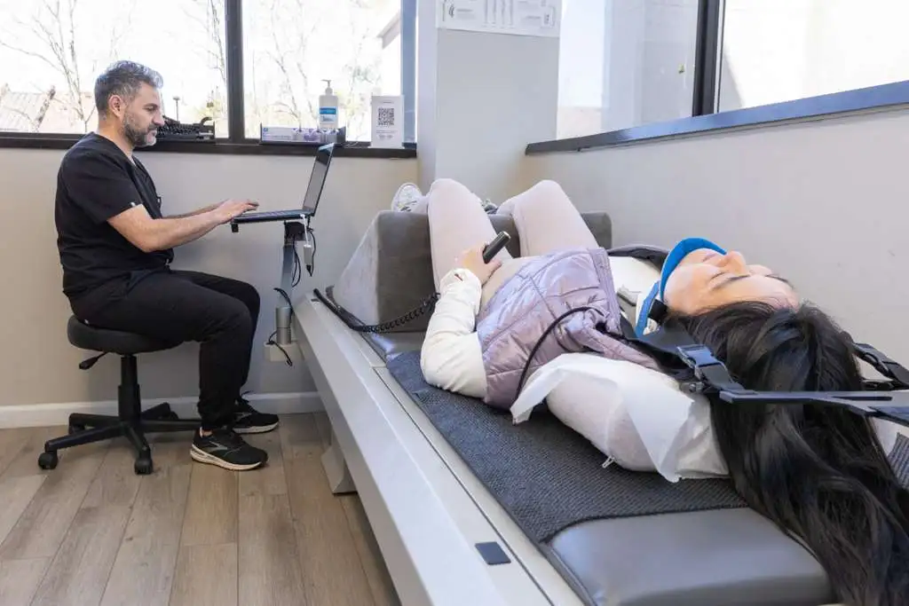 persons hand on white textile