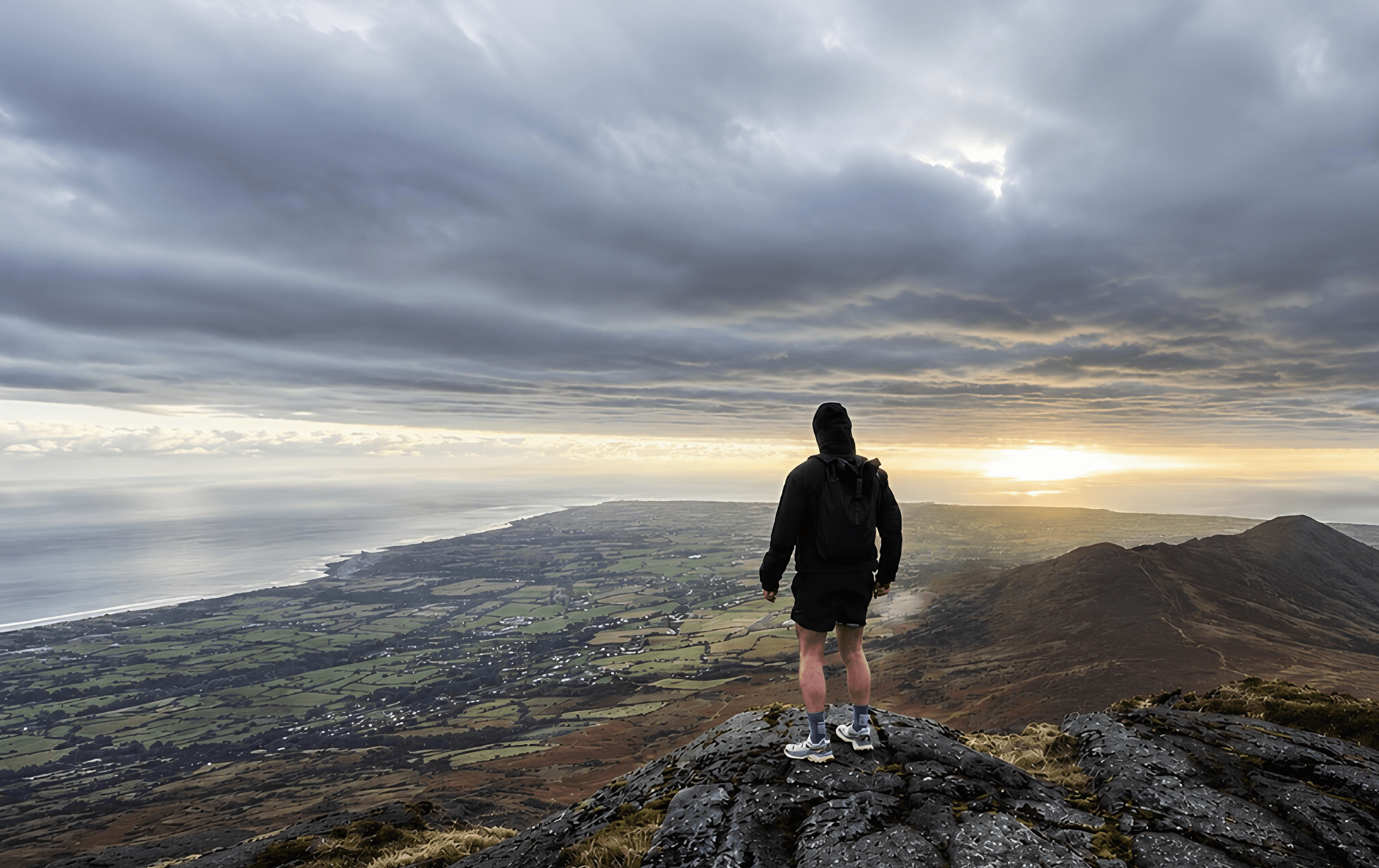 Three women in yoga poses in a bright studio.