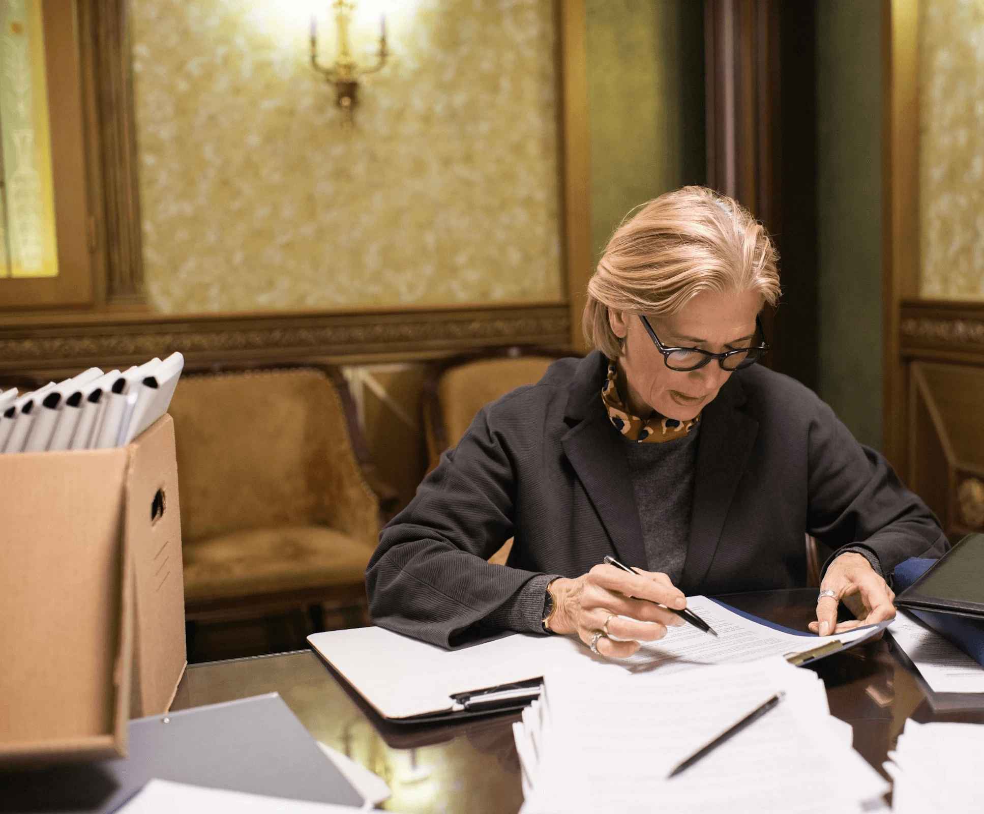Women Siting and Checking the Papers