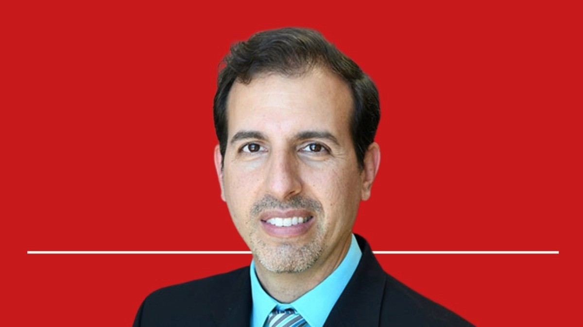 Image of Dr. Roger Seheult, Value Health Voices Podcast Guest, against a red background.