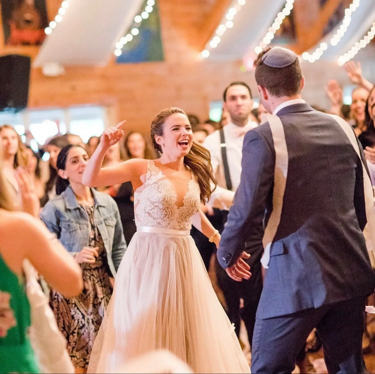 Bride and guests dancing at a wedding at Camp Lenox