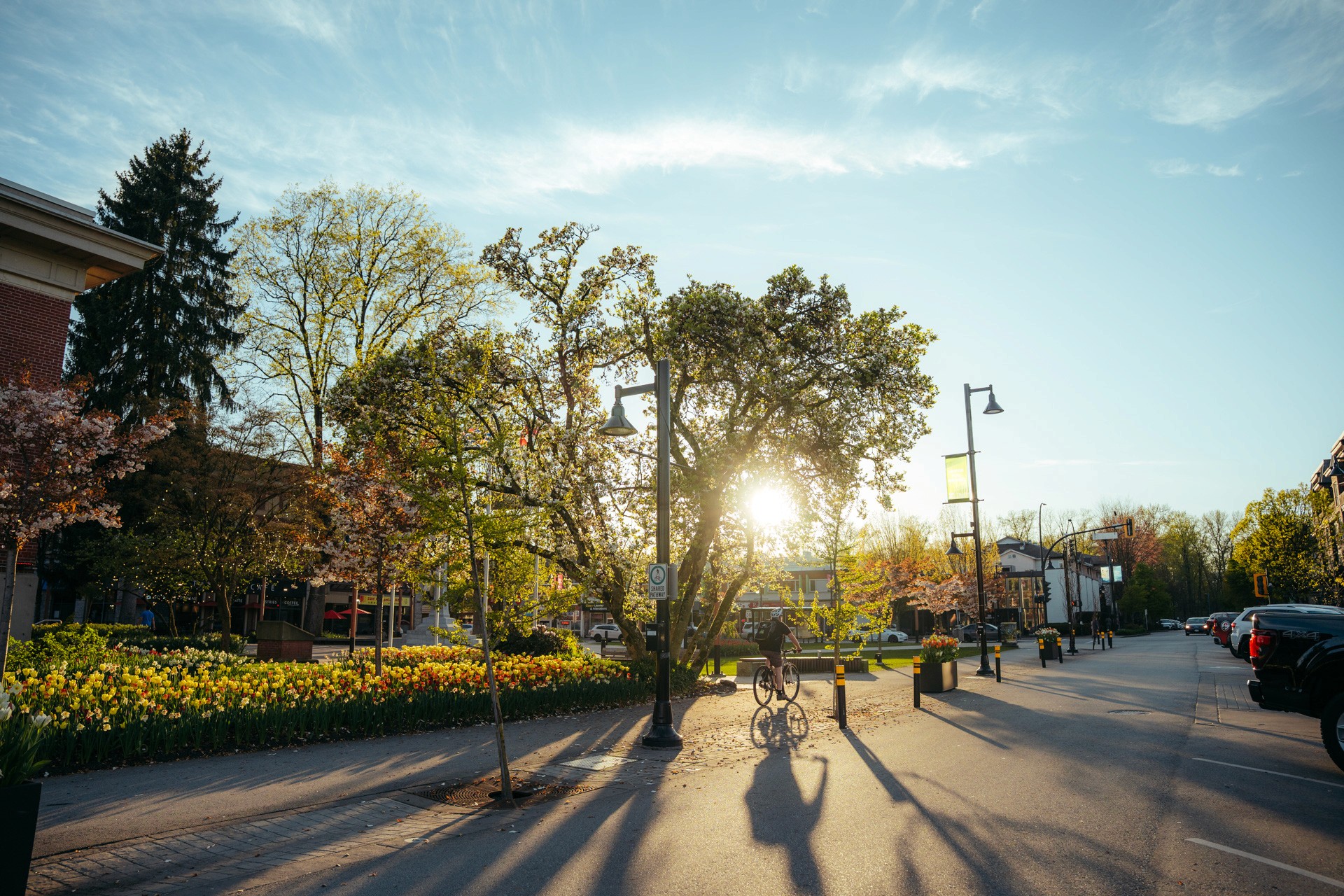 A female volleyball player in a white jersey (number 16) in a defensive stance near the net during a match.