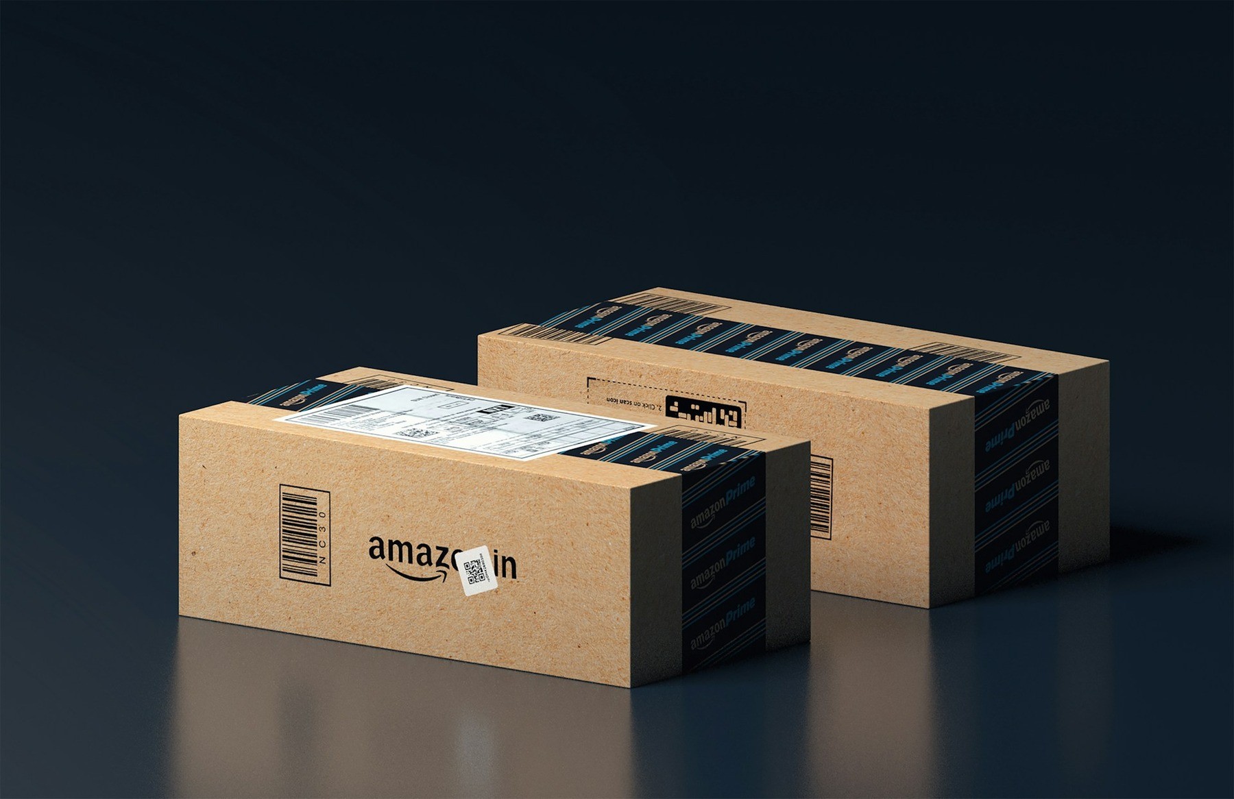 Amazon shipping boxes on a dark background