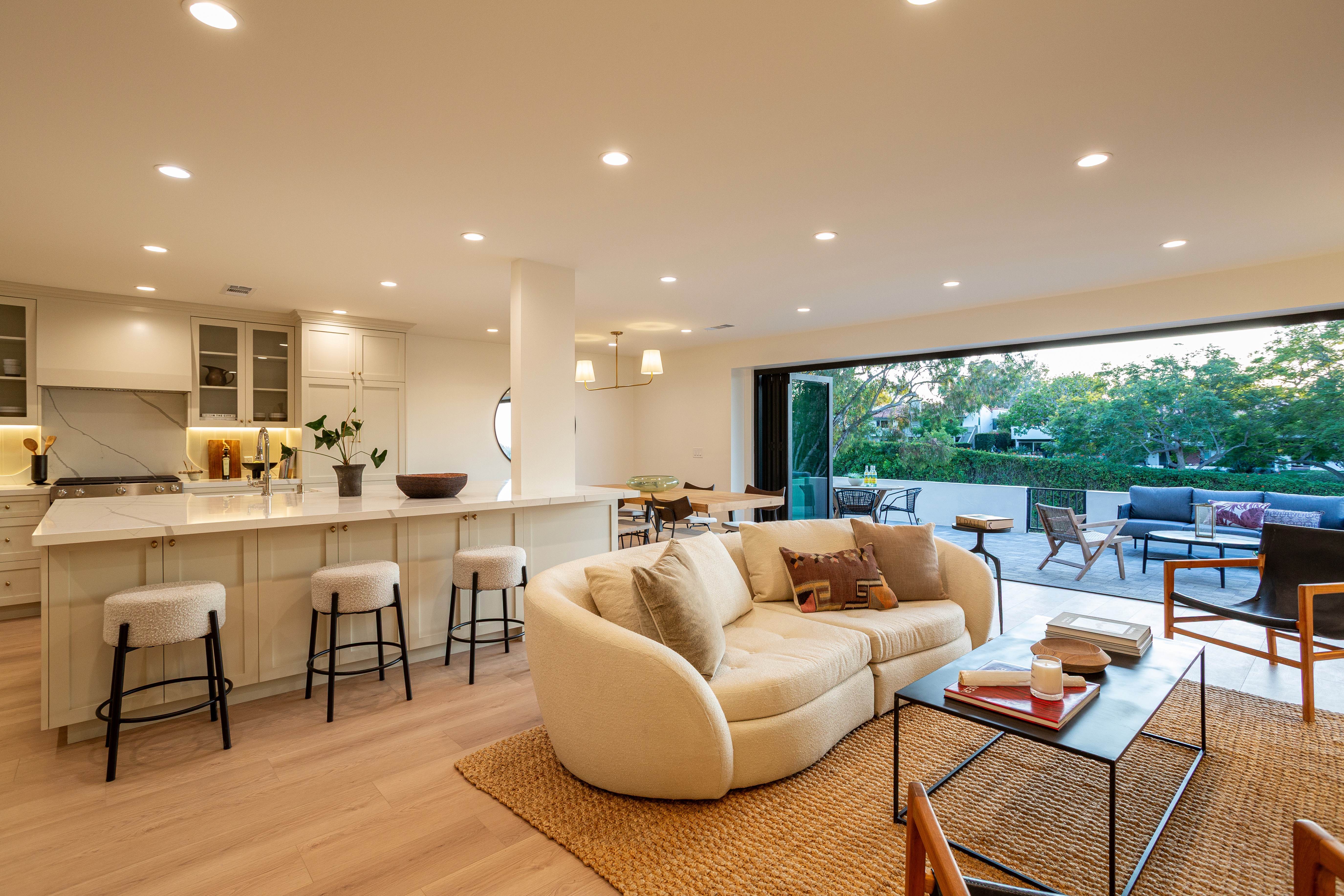 Modern open-concept living room with natural light and upgraded finishes