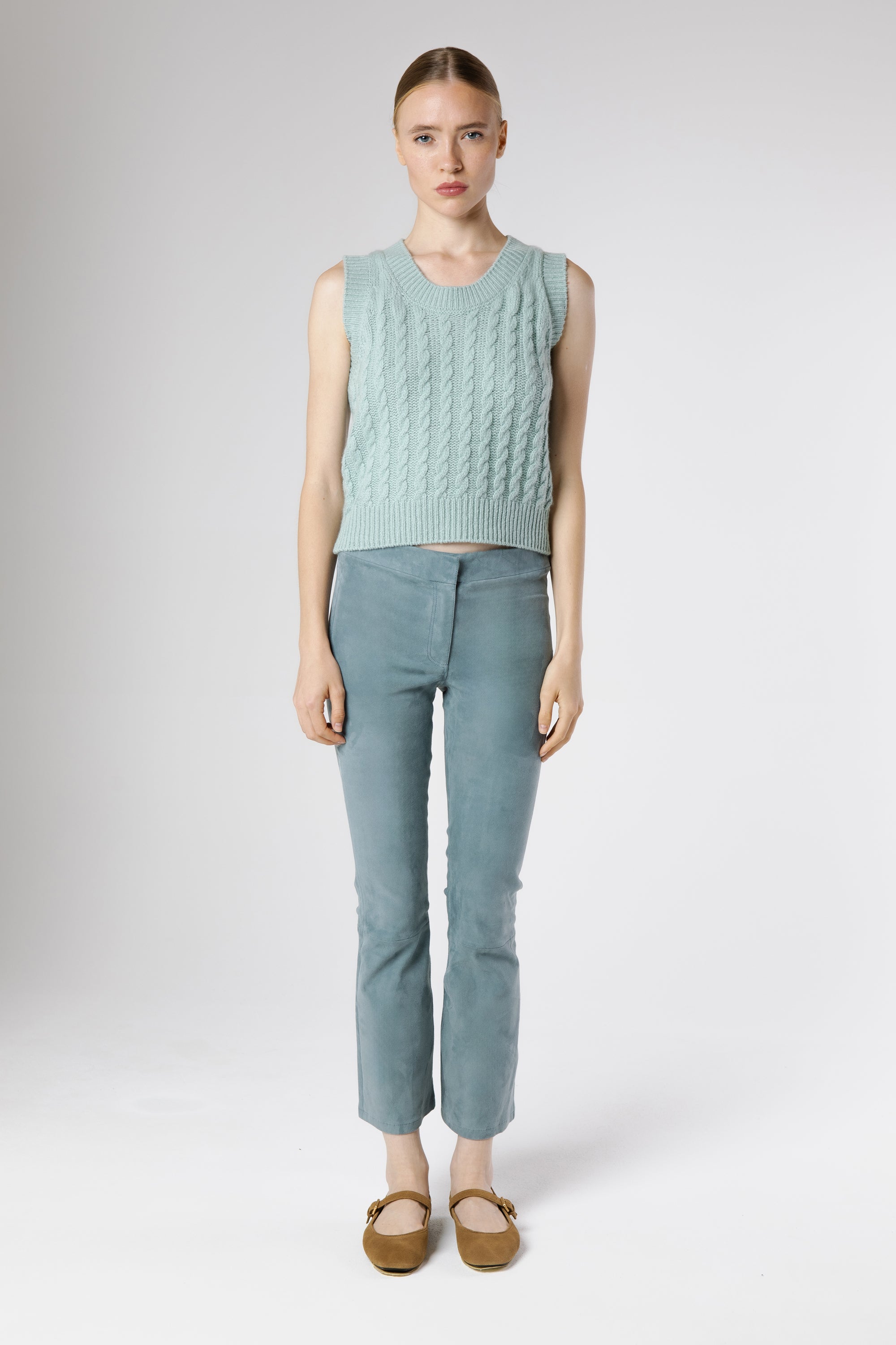 Model wearing Bella Cashmere Top Dew styled with tailored trousers in coordinated soft blue look.