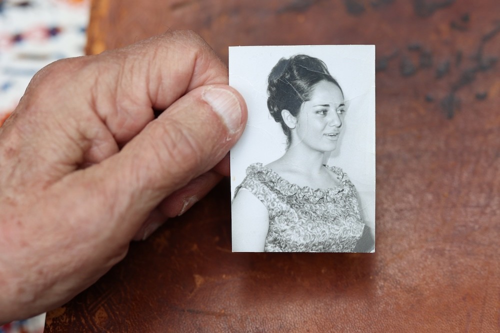 Bubjan with book and speaking to camera
