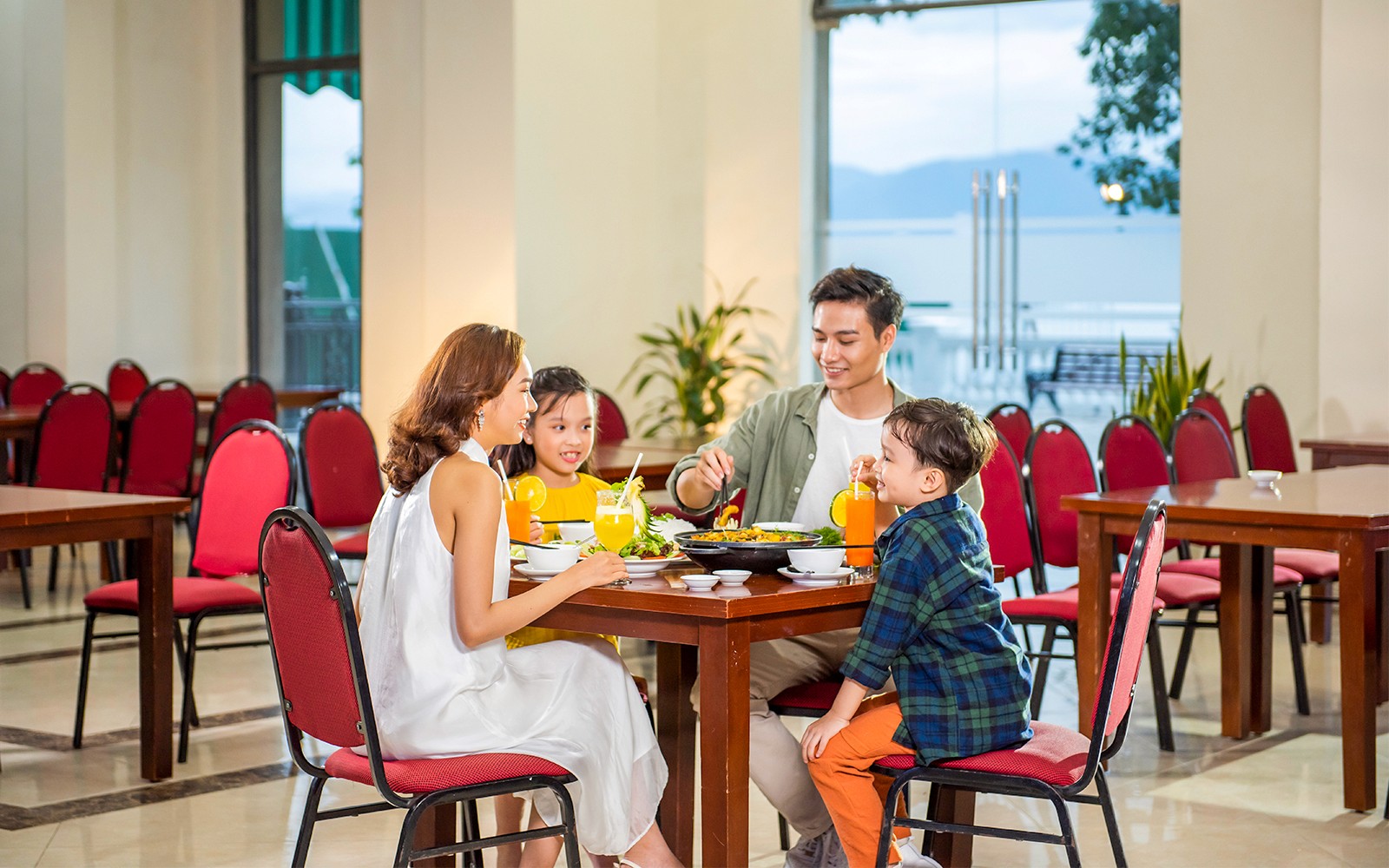Family dining at a restaurant in VinWonders Nha Trang.