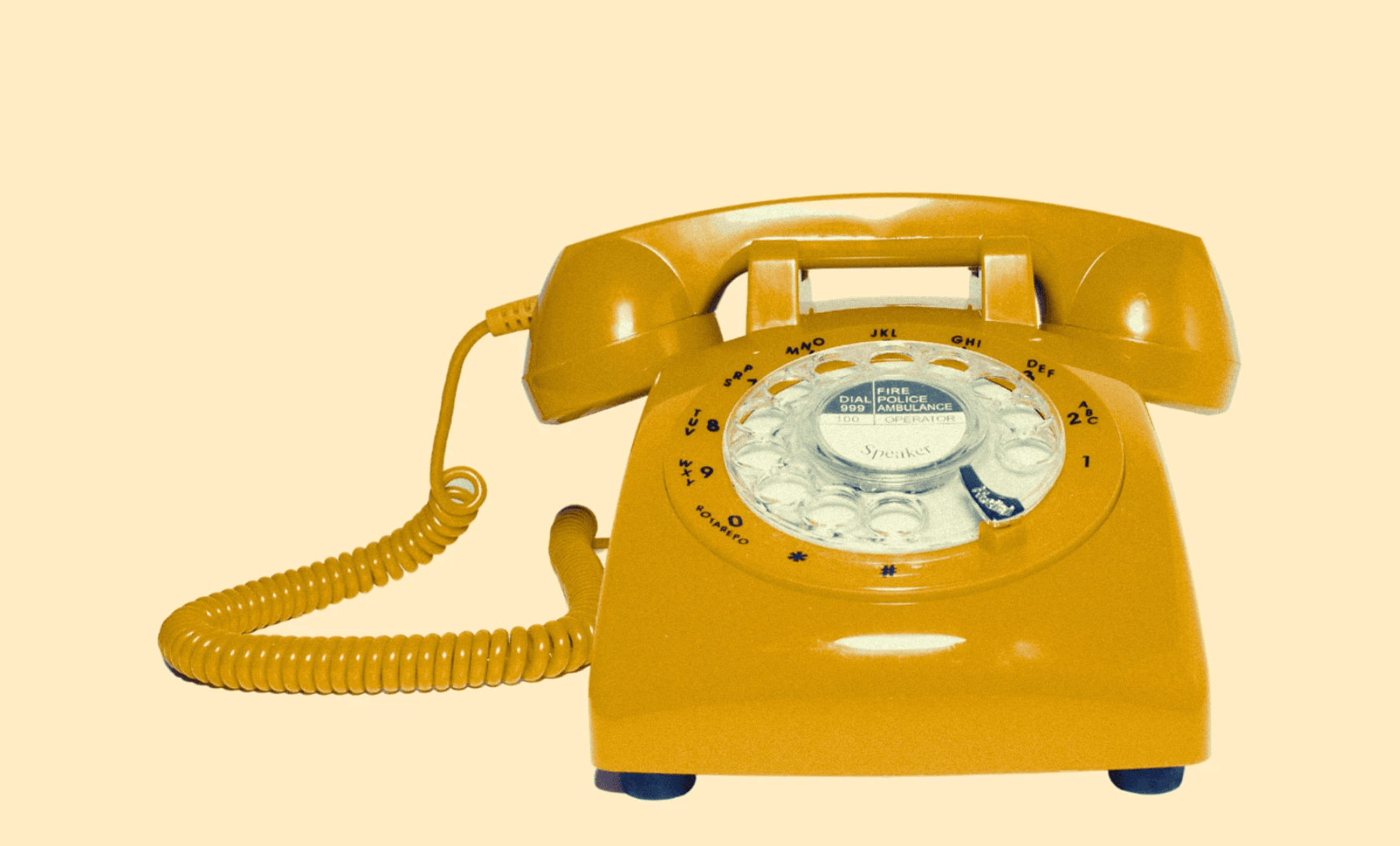 Image of a yellow vintage phone.