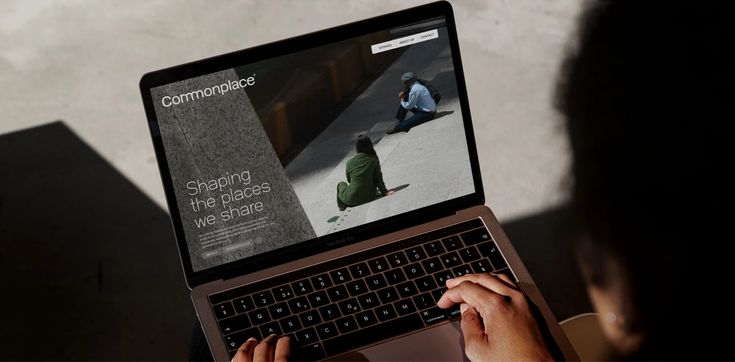 Team members in an office setting having a discussion, representing clear communication throughout the project process.