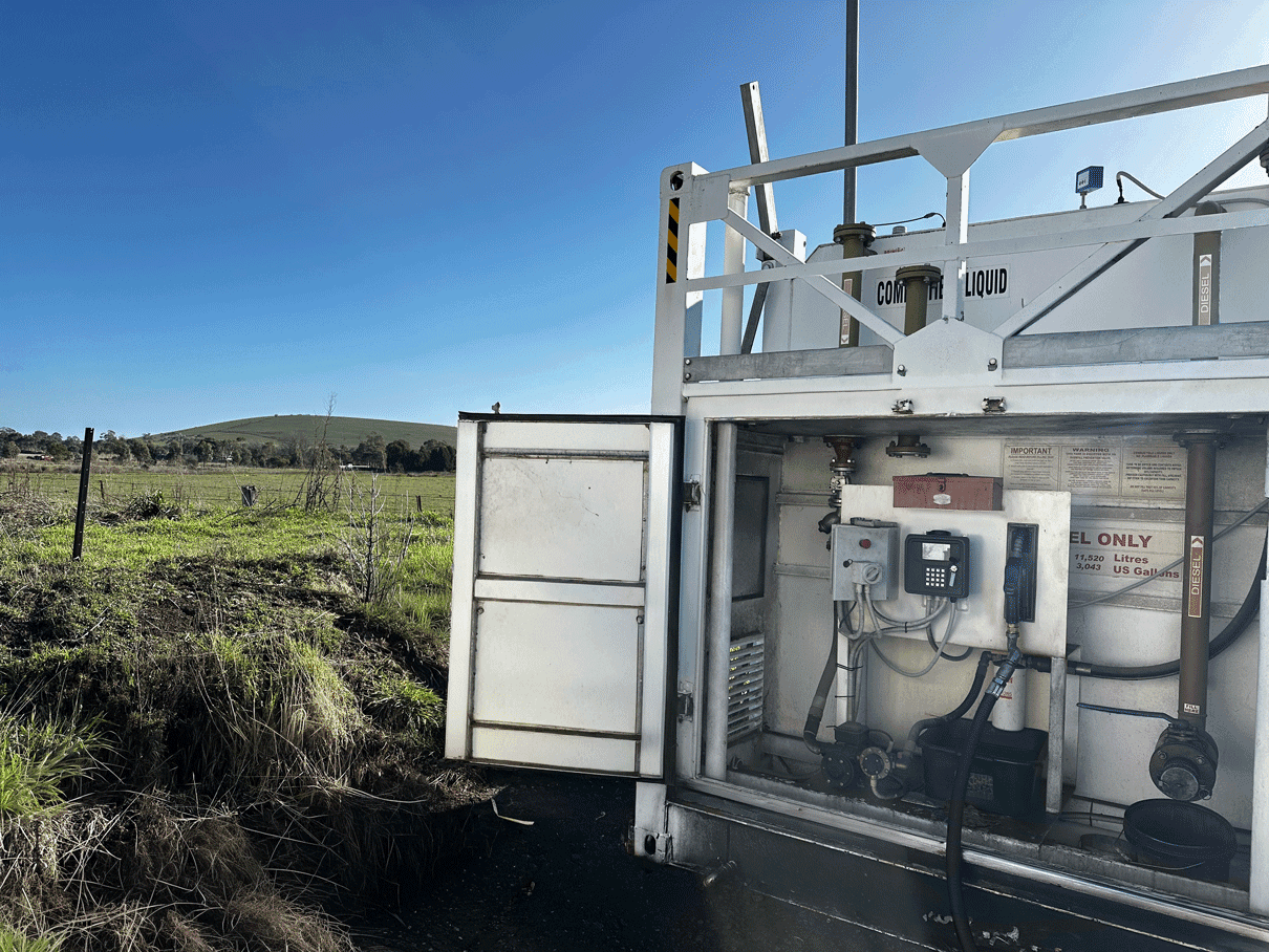 mage of the SmartFill Gen 3 operating on a mining site with a truck in the background.