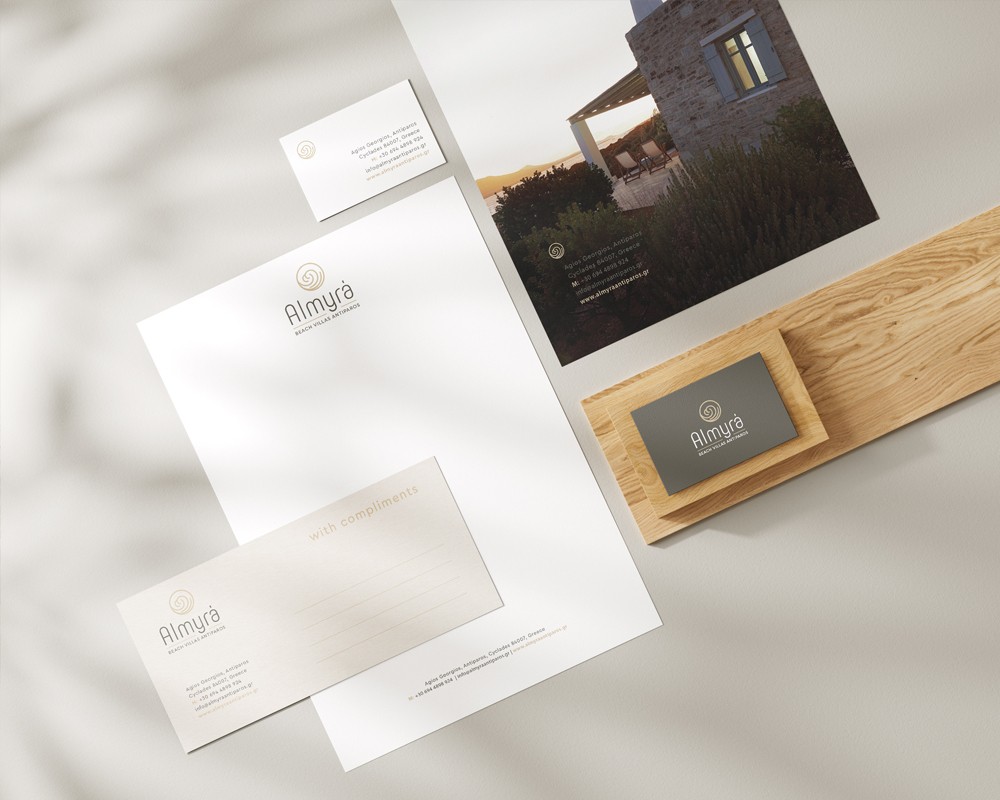 Almyra Antiparos branded brochure and printed hospitality collateral styled with decorative ceramic object