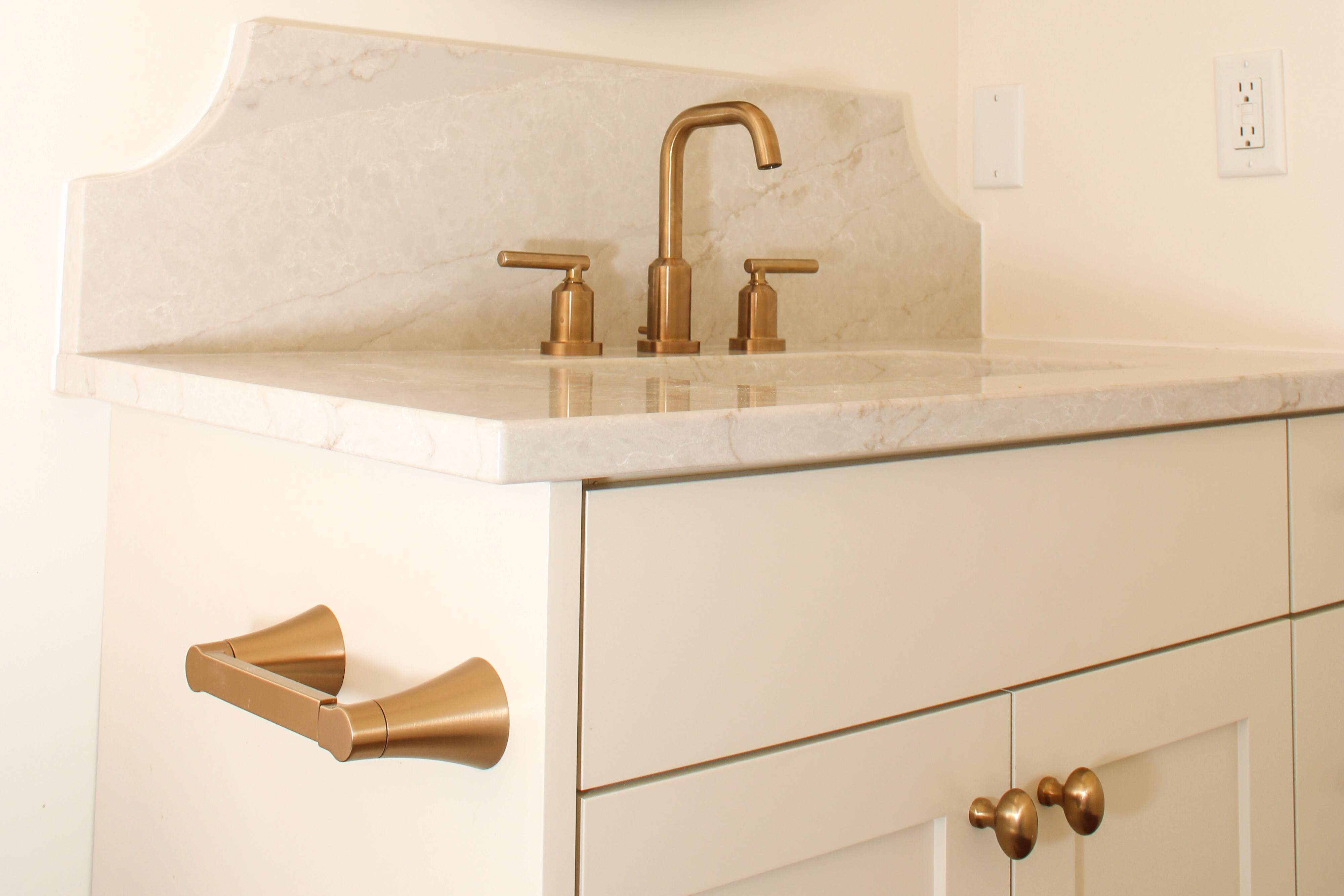 White painted cabinetry and countertop with modern plumbing in a Southern Utah bathroom remodel
