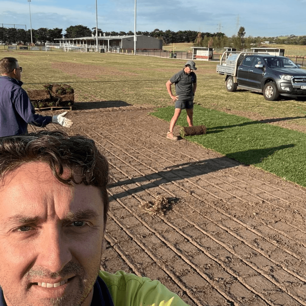 Volunteer groundskeepers maintaining the playing surface at Elcho Park.