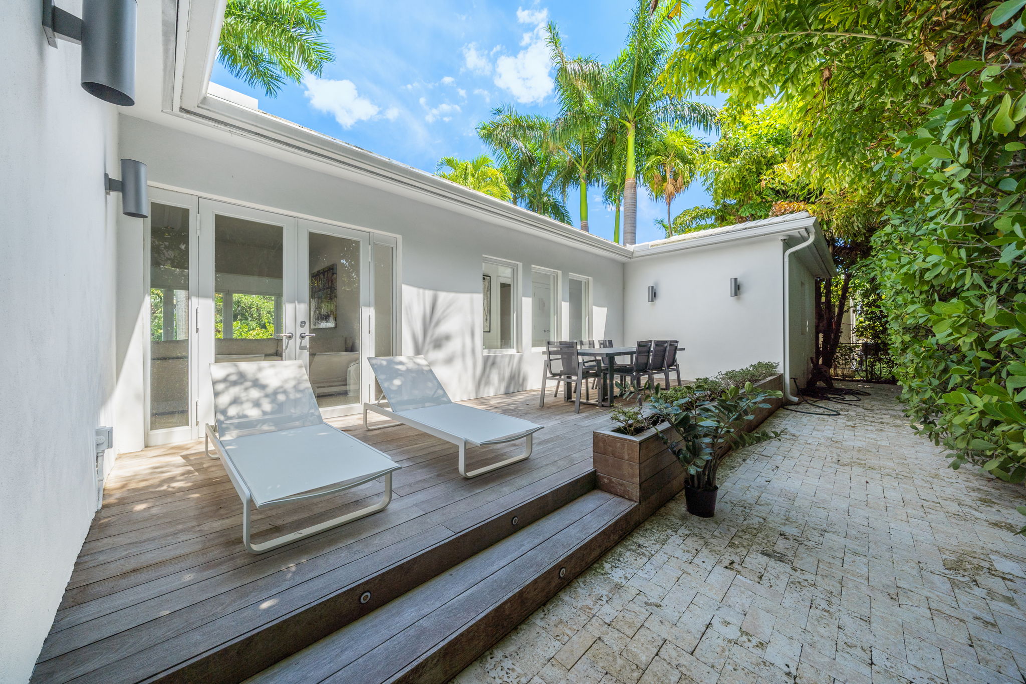 flat lay shot of spa amenities by the bathtub