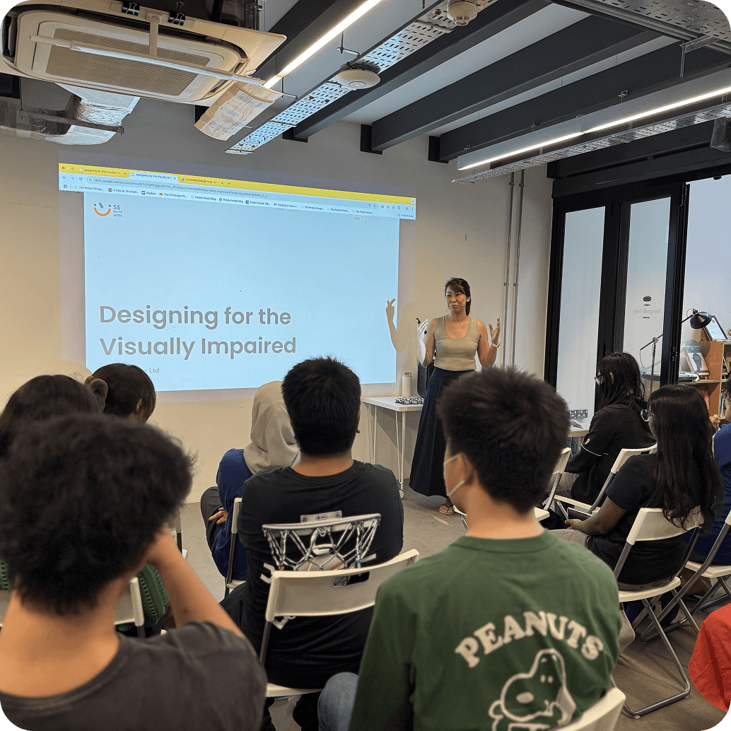 Students viewing a projection of PowerPoint slides and listening to Wendy's talk