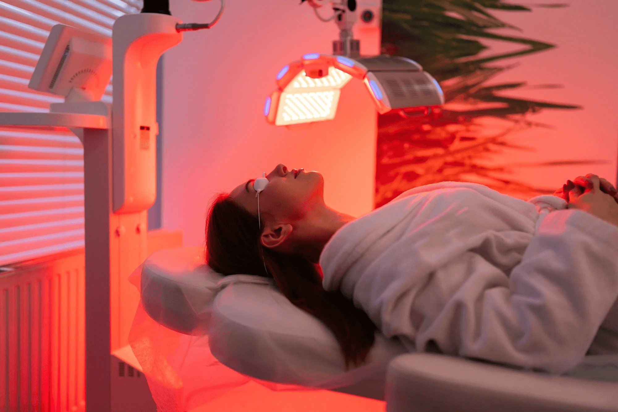 A woman receives a relaxing energy healing in a serene setting with soft lighting.